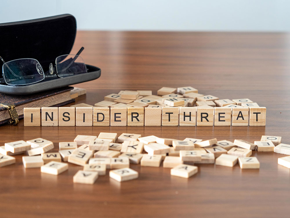 How should businesses and organisations protect against insider threats?
